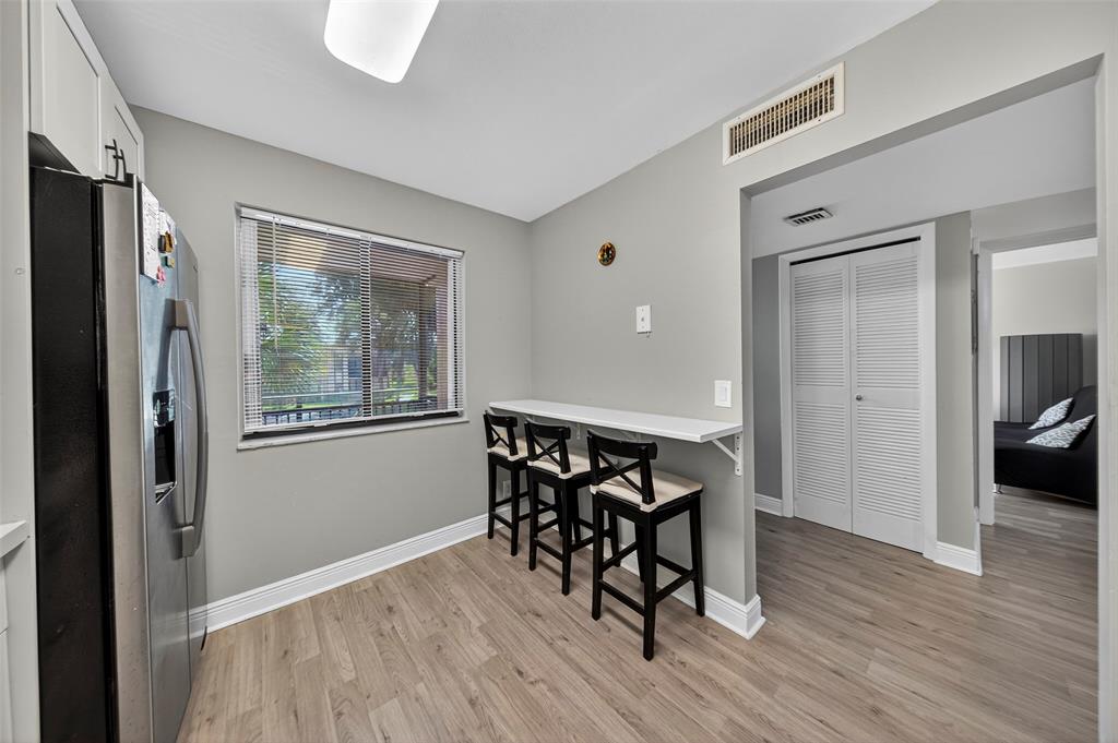 412 Lakeview Drive, Unit 202 Weston, FL 33326 - Photo 10 of 34 a view of a livingroom with furniture and wooden floor