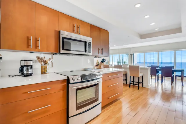 a bedroom with a bed a couch and a book shelf
