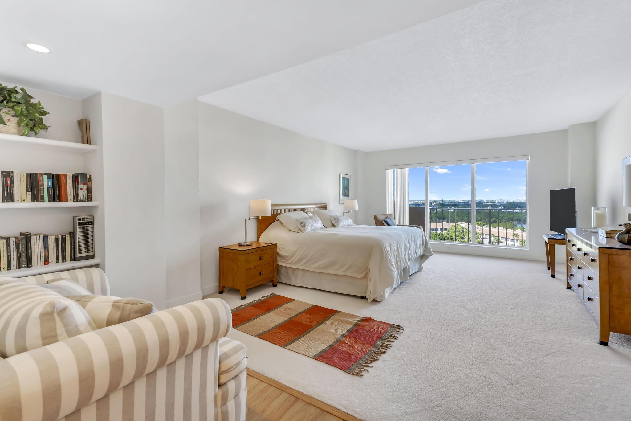 4301 North Ocean Boulevard, Unit 1002 Boca Raton, FL 33431 - Photo 18 of 71 a bedroom with a bed and a large window