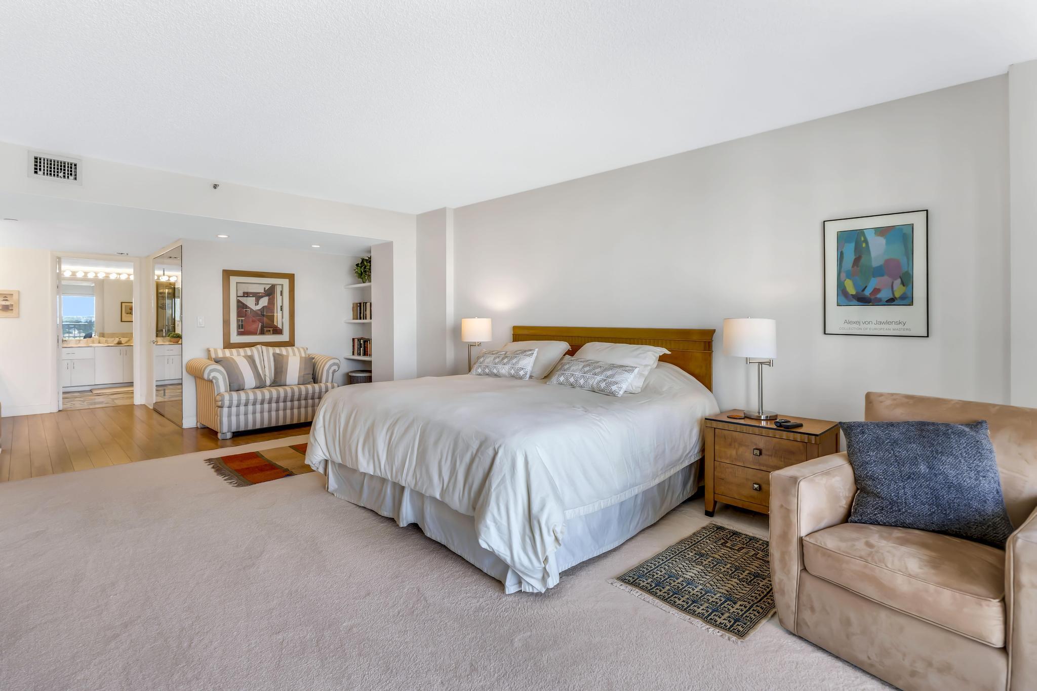 4301 North Ocean Boulevard, Unit 1002 Boca Raton, FL 33431 - Photo 19 of 71 a bedroom with furniture and a couch