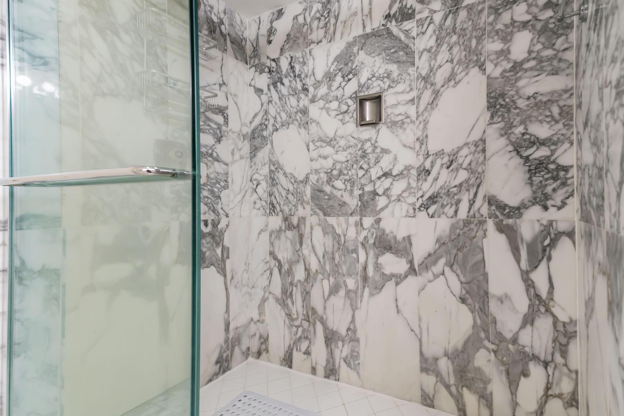 4301 North Ocean Boulevard, Unit 1002 Boca Raton, FL 33431 - Photo 27 of 71 a bathroom with a shower curtain