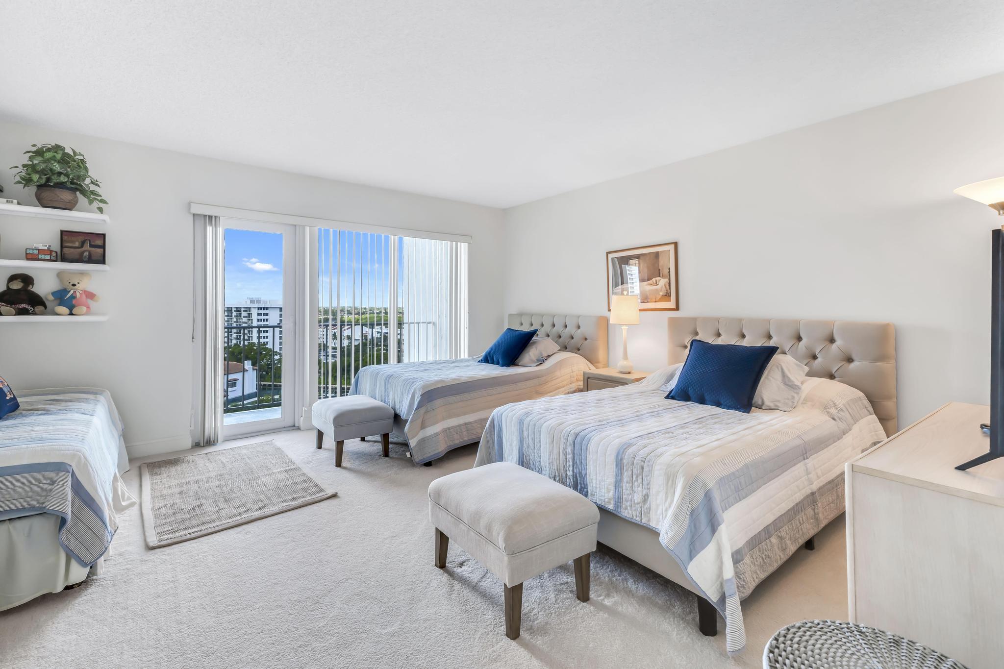 4301 North Ocean Boulevard, Unit 1002 Boca Raton, FL 33431 - Photo 28 of 71 a bedroom with two beds and large window
