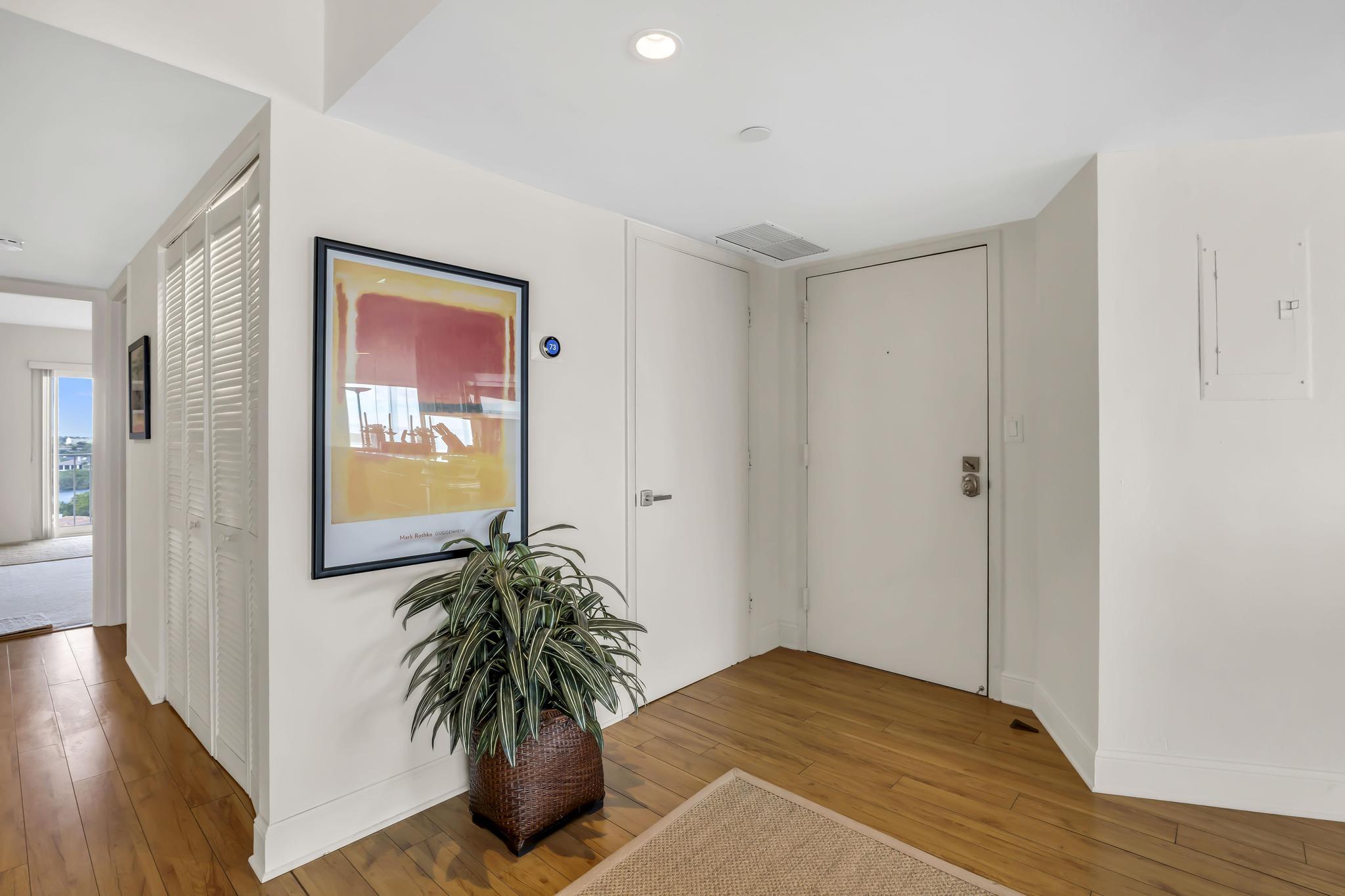 4301 North Ocean Boulevard, Unit 1002 Boca Raton, FL 33431 - Photo 3 of 71 a living room with furniture and a flat screen tv