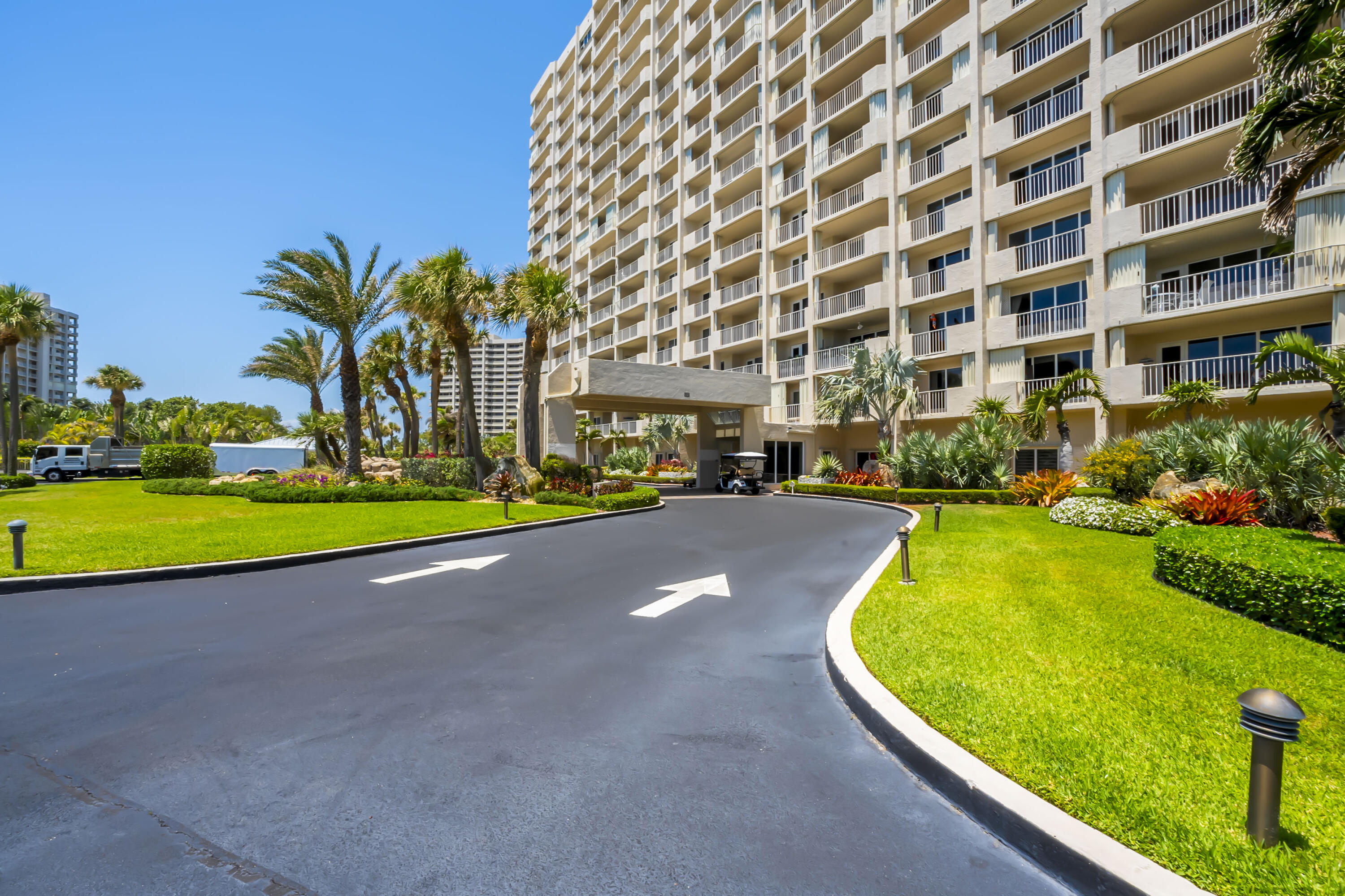 4301 North Ocean Boulevard, Unit 1002 Boca Raton, FL 33431 - Photo 53 of 71 a swimming pool with outdoor seating and yard