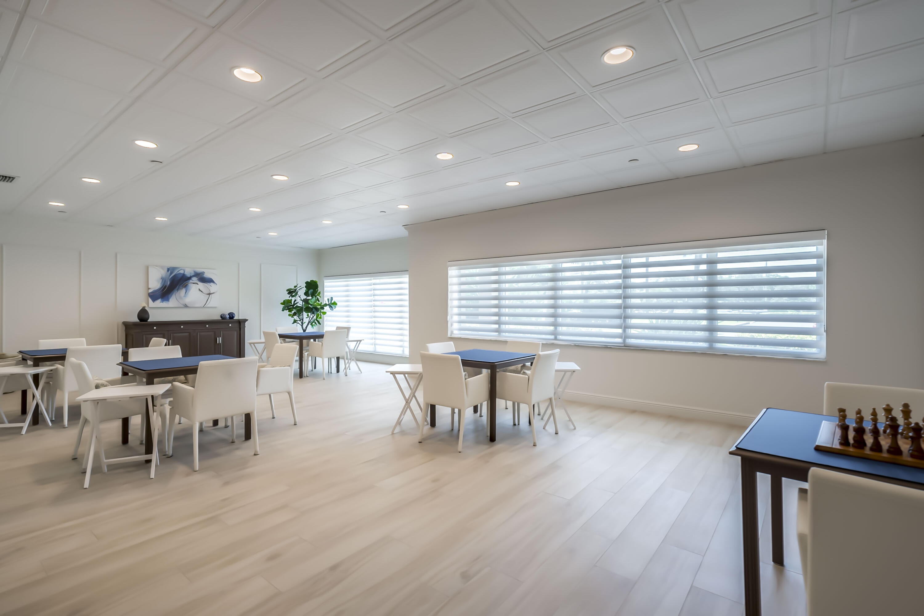 4301 North Ocean Boulevard, Unit 1002 Boca Raton, FL 33431 - Photo 56 of 71 a view of a dining room with furniture window and wooden floor