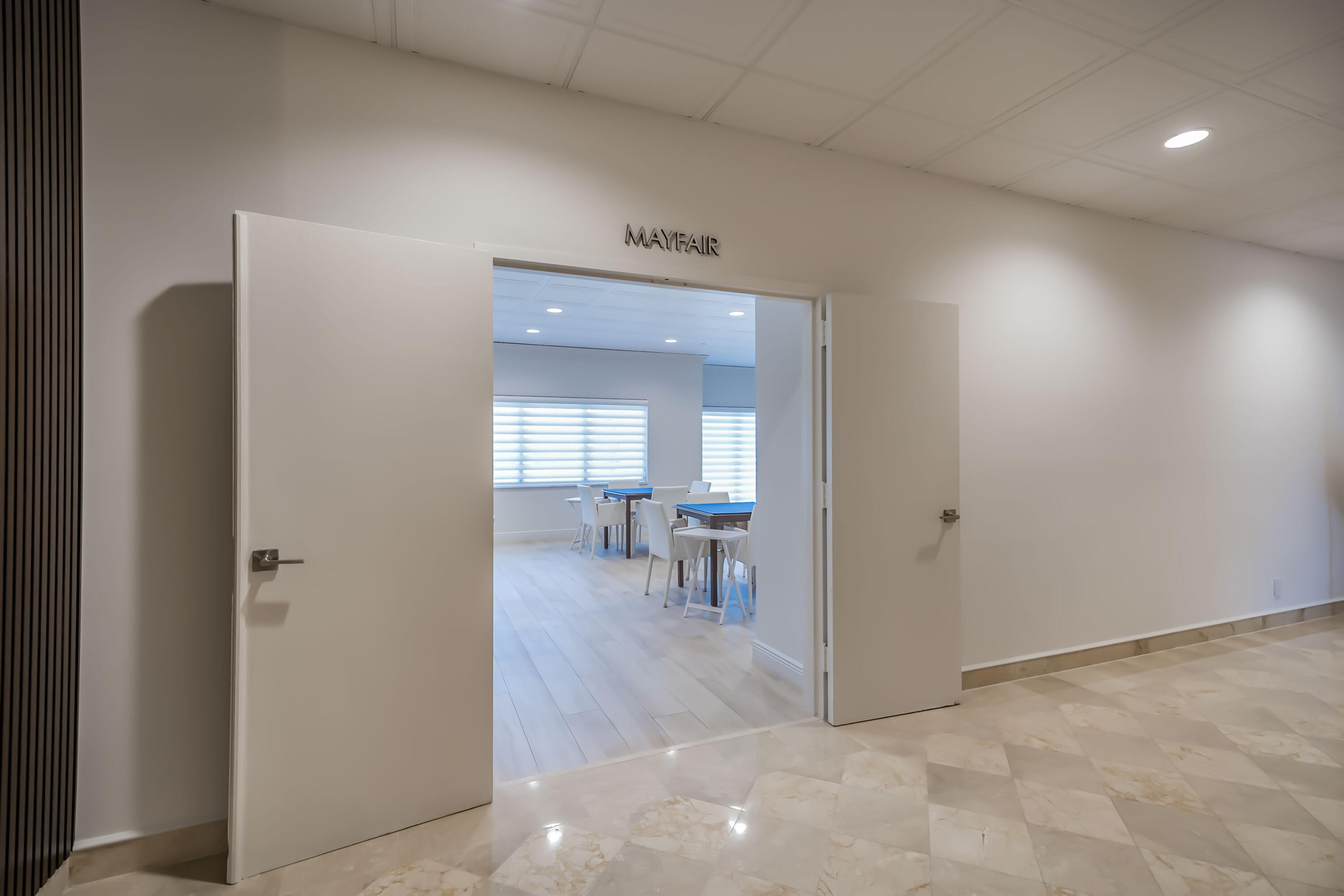 4301 North Ocean Boulevard, Unit 1002 Boca Raton, FL 33431 - Photo 58 of 71 a view of a hallway to a livingroom with furniture and a window