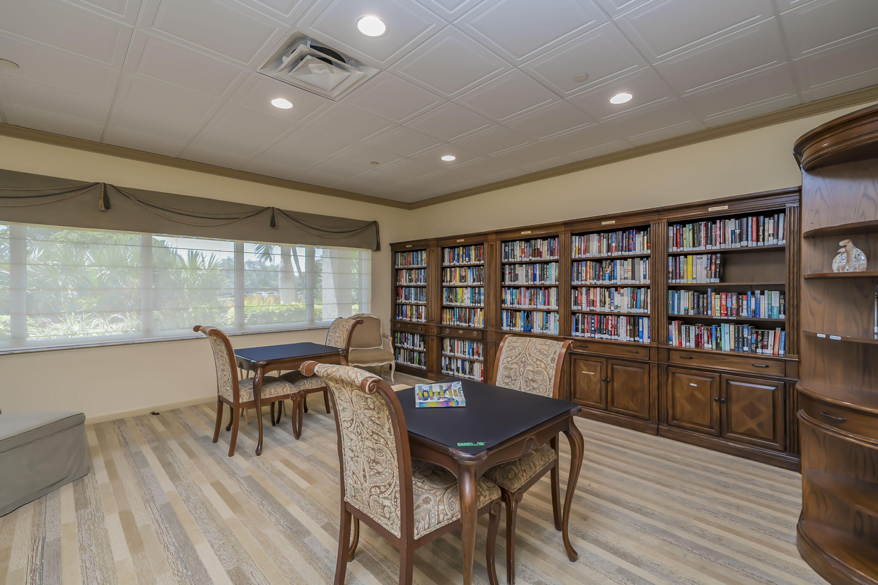 4301 North Ocean Boulevard, Unit 1002 Boca Raton, FL 33431 - Photo 59 of 71 a view of a dining room with furniture window and wooden floor