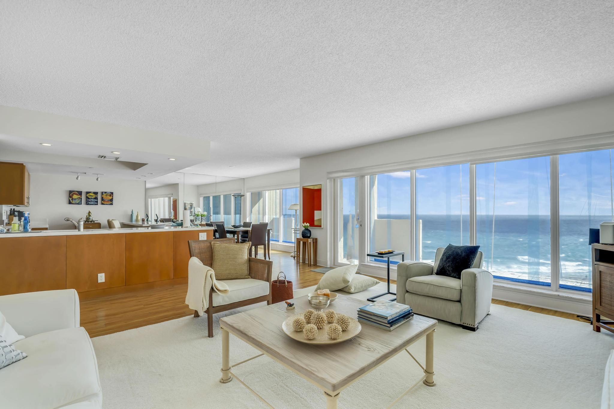 4301 North Ocean Boulevard, Unit 1002 Boca Raton, FL 33431 - Photo 6 of 71 a living room with furniture and a table