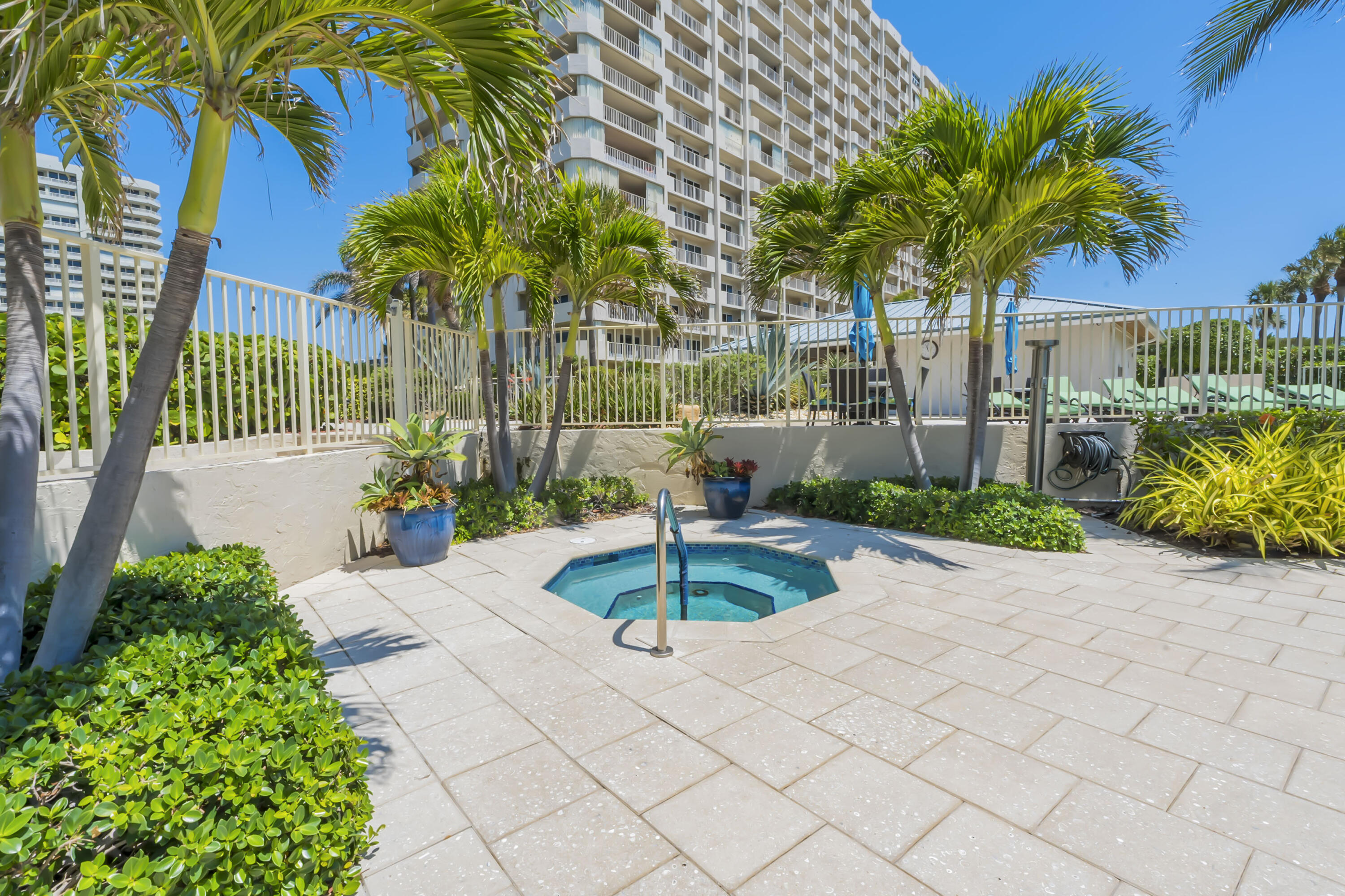 4301 North Ocean Boulevard, Unit 1002 Boca Raton, FL 33431 - Photo 66 of 71 a front view of a house with a yard and a garden