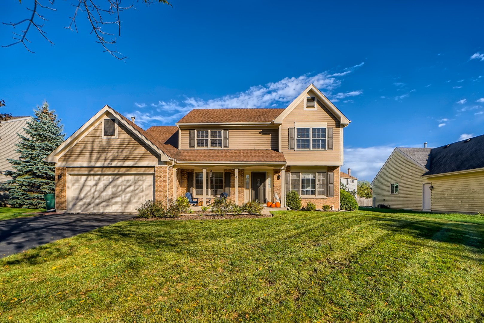 1083 Sumner Circle Gurnee, IL 60031 - Photo 1 of 27 a front view of a house with a yard