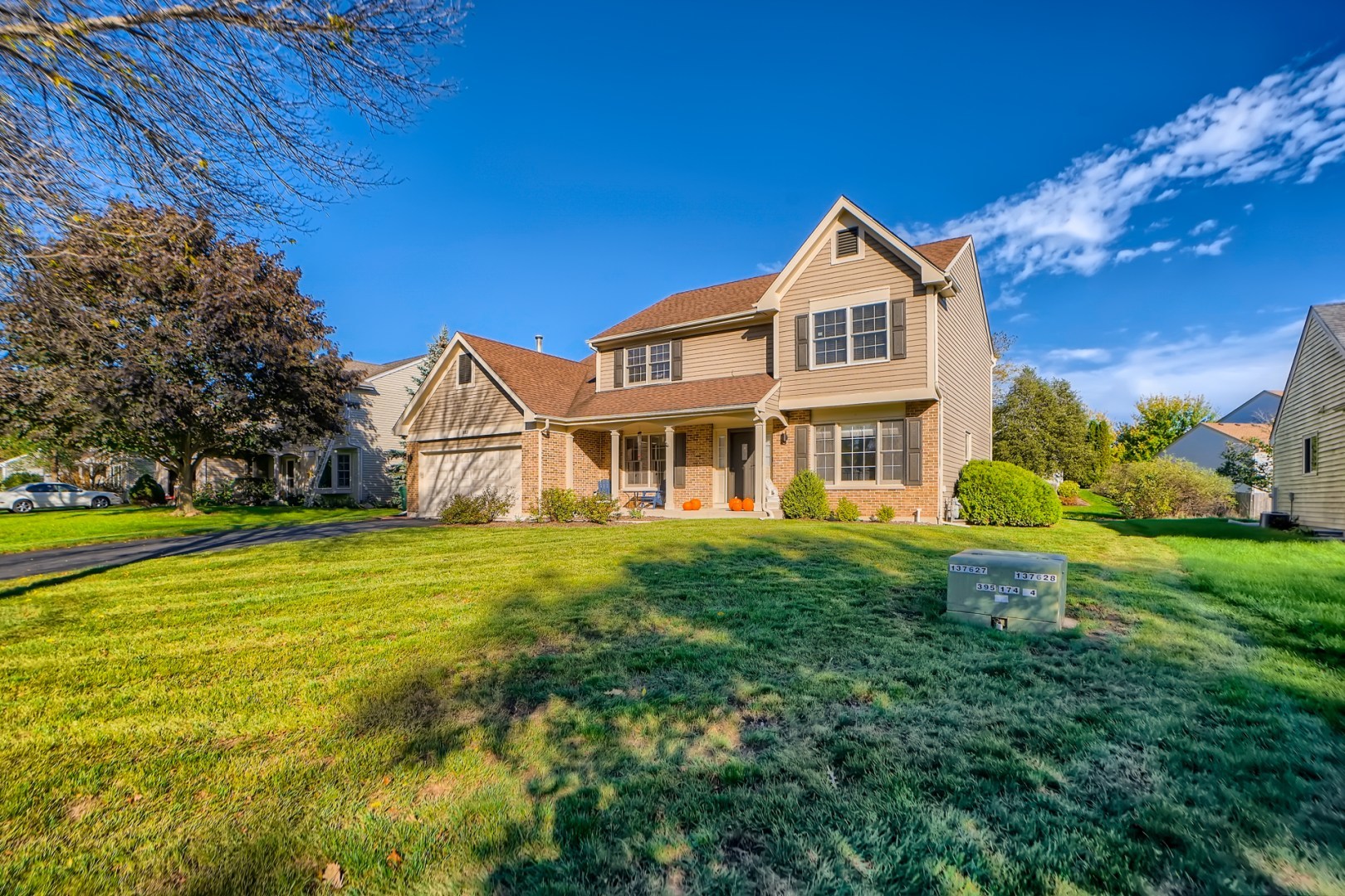 1083 Sumner Circle Gurnee, IL 60031 - Photo 2 of 27 a front view of a house with a yard and garage