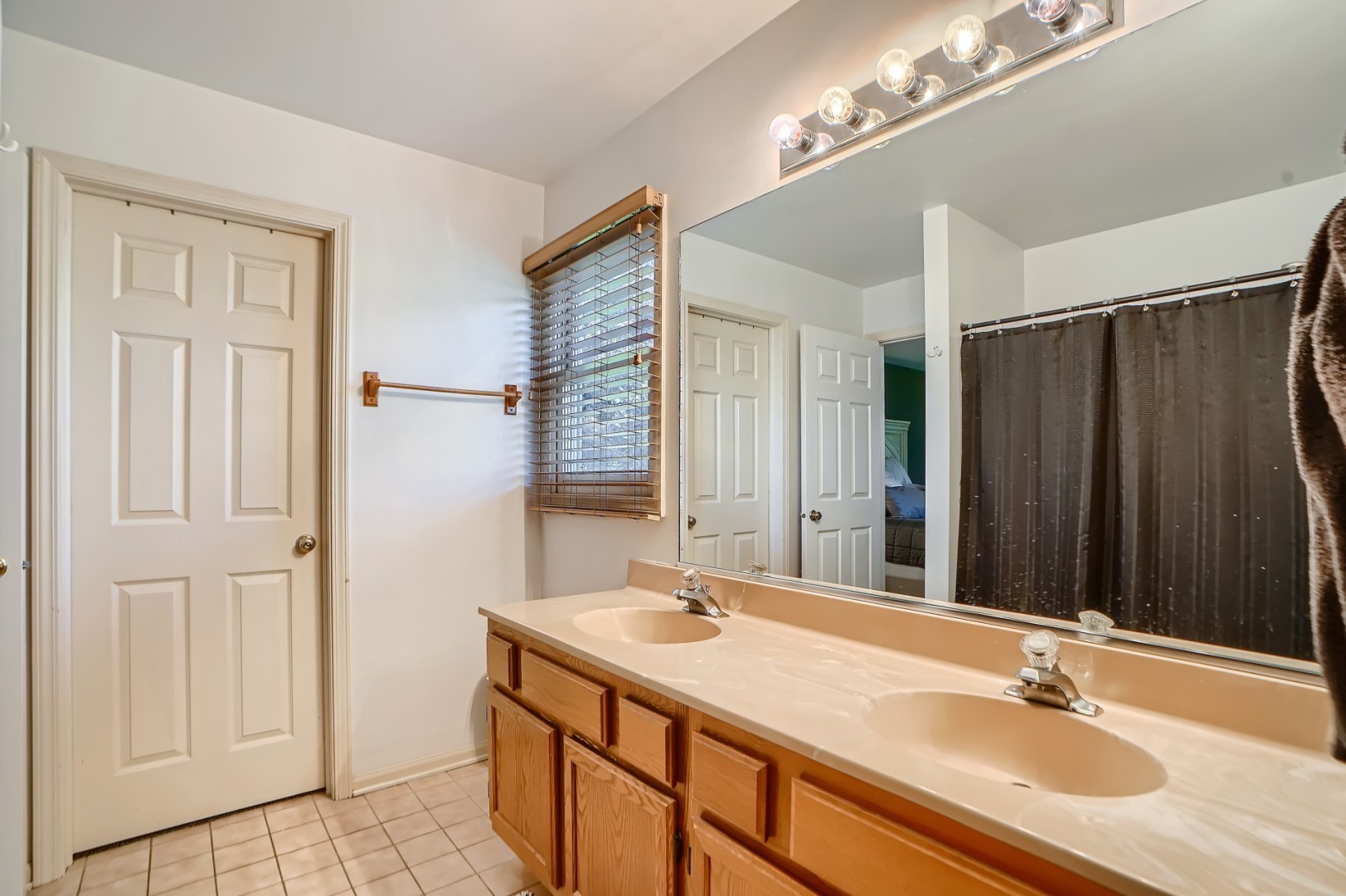 1083 Sumner Circle Gurnee, IL 60031 - Photo 21 of 27 a bathroom with a sink double vanity and a mirror