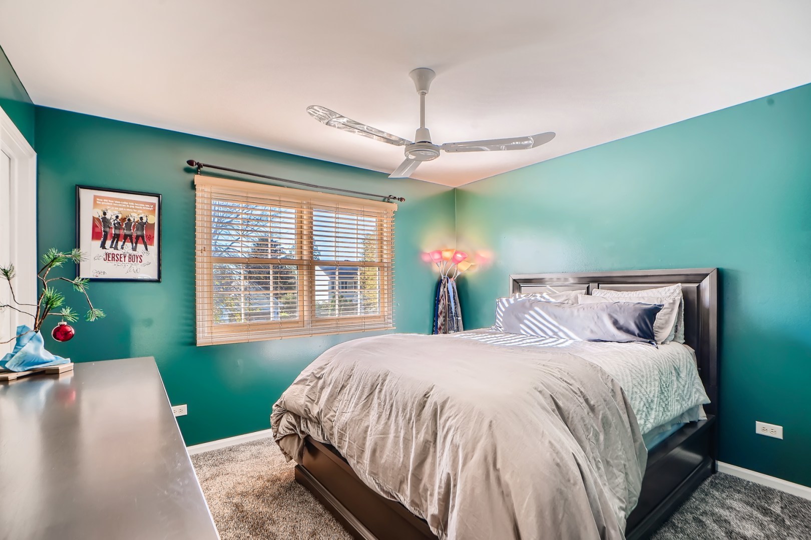 1083 Sumner Circle Gurnee, IL 60031 - Photo 22 of 27 a bedroom with a bed chandelier and a window