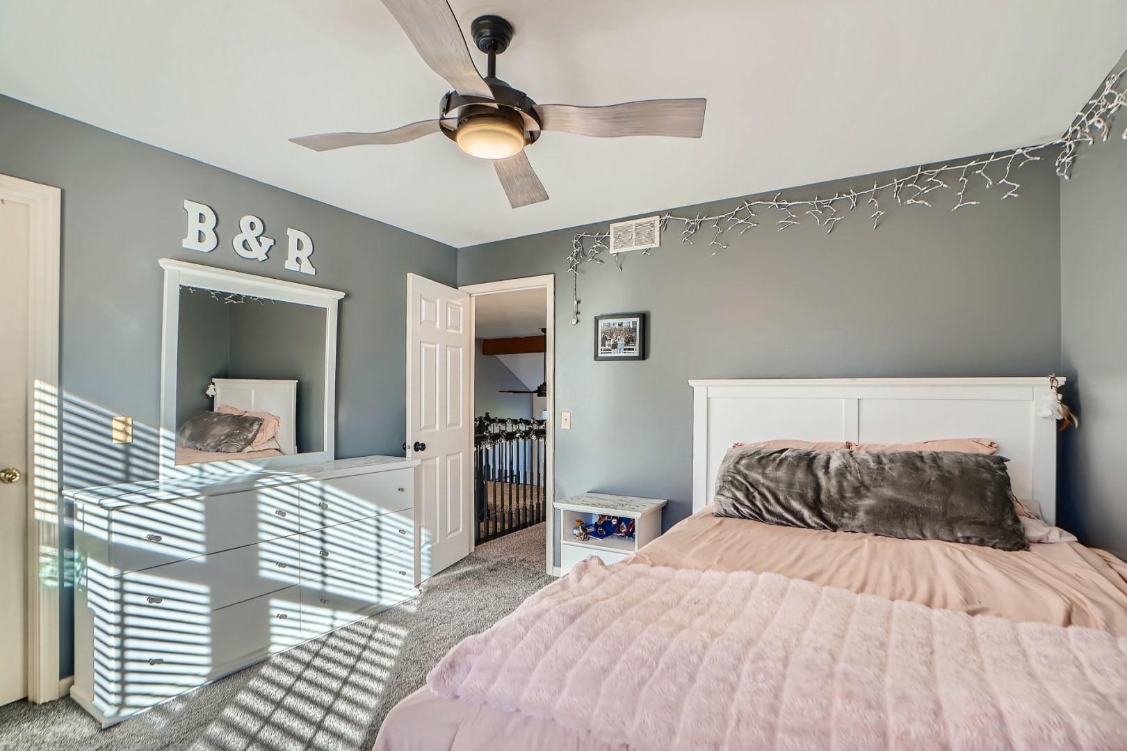 1083 Sumner Circle Gurnee, IL 60031 - Photo 25 of 27 a bedroom with a bed and a chandelier