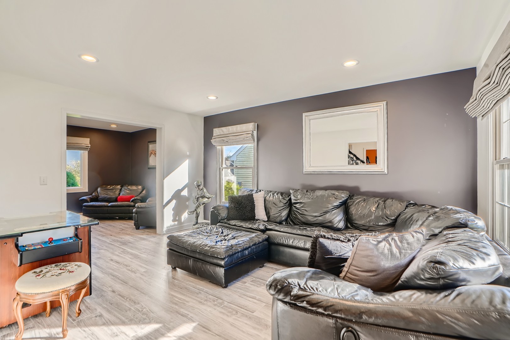 1083 Sumner Circle Gurnee, IL 60031 - Photo 8 of 27 a living room with furniture and a flat screen tv