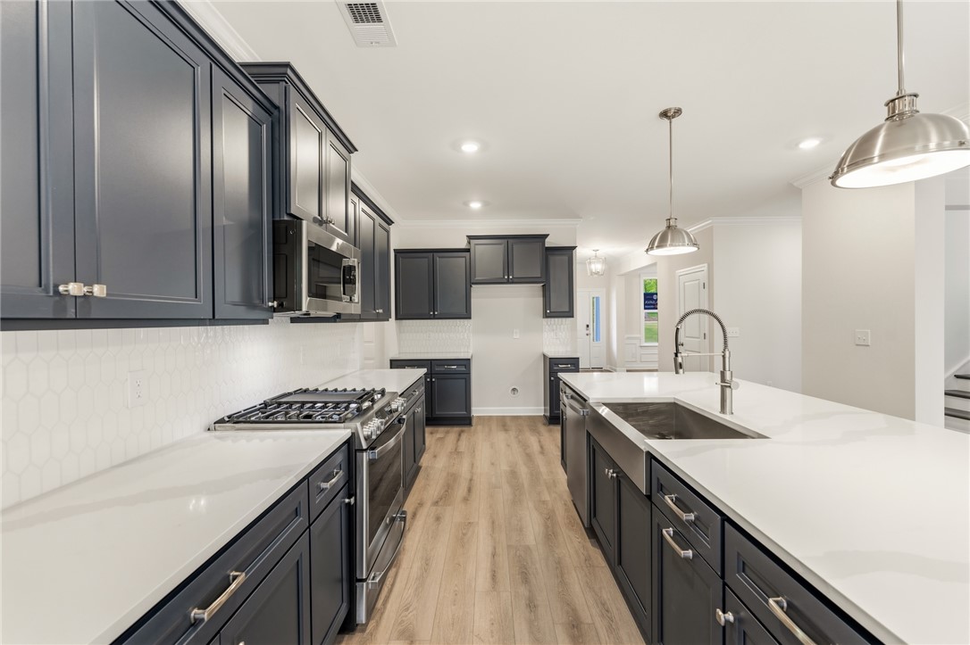 1108 Manse Jolly Road Anderson, SC 29621 - Photo 10 of 45 This kitchen features sleek cabinetry and modern appliances, perfect for culinary enthusiasts.