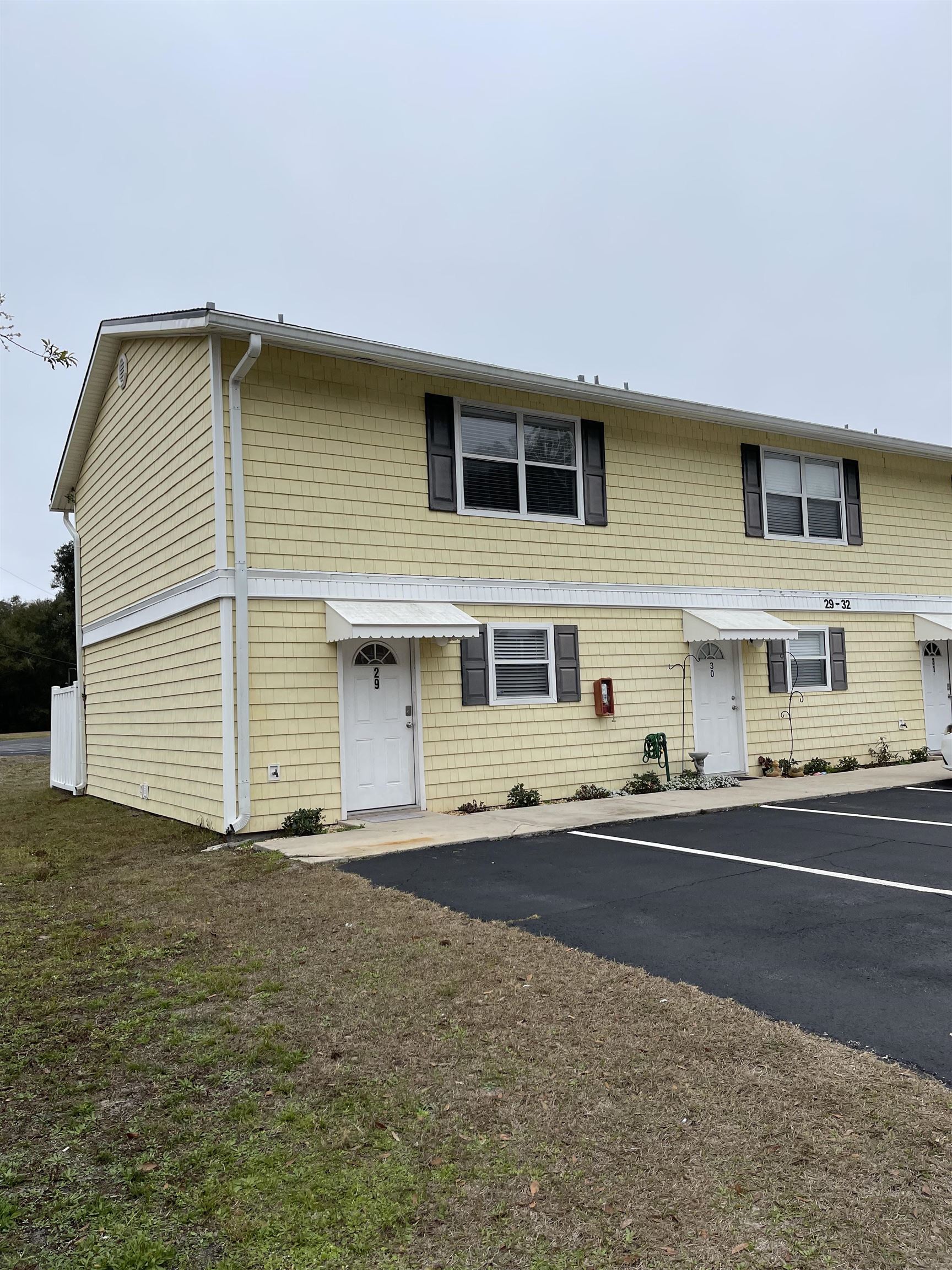 4420 Carter Road, Unit 29 St. Augustine, FL 32086 - Photo 1 of 15 a front view of building with road