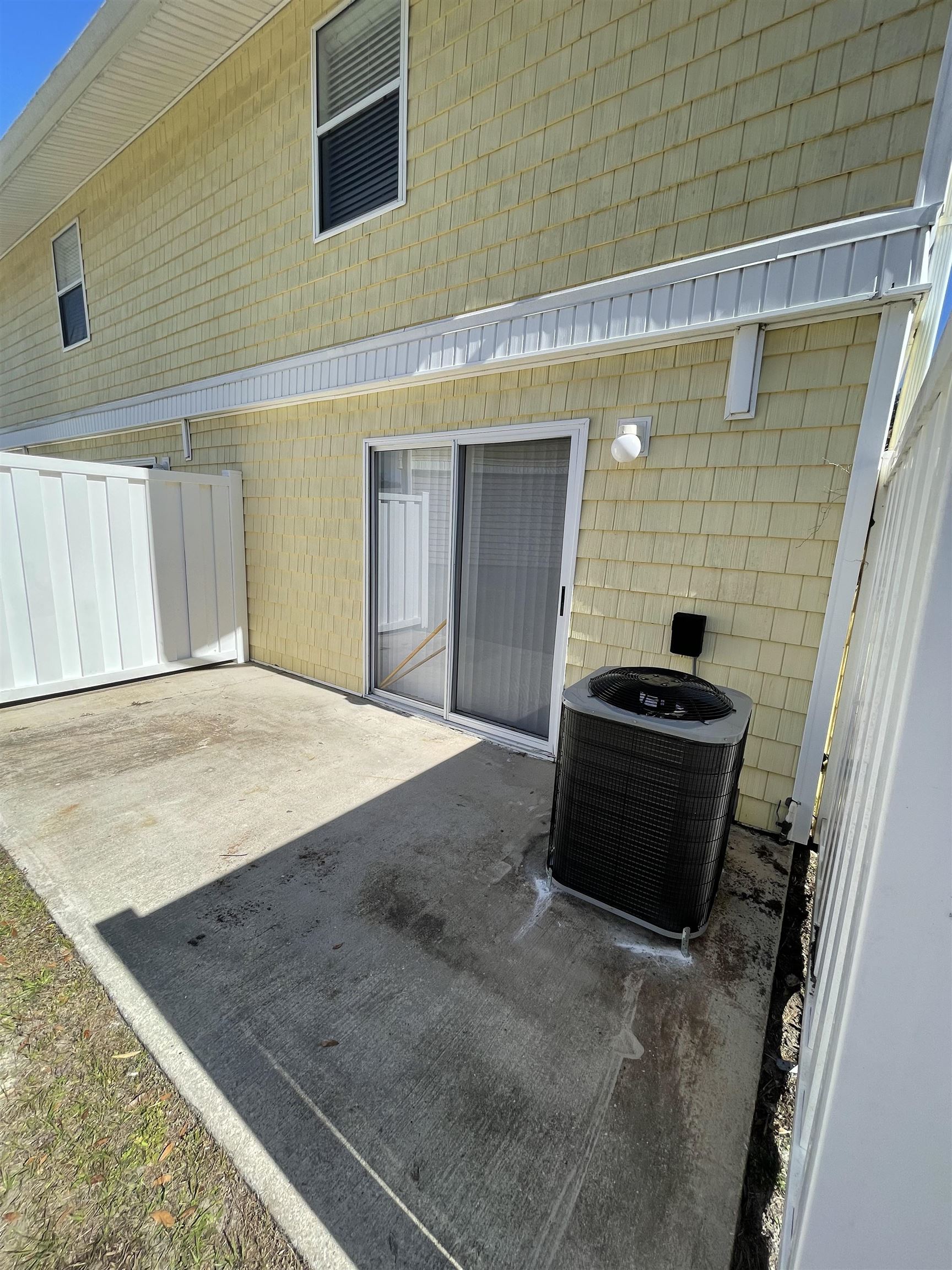 4420 Carter Road, Unit 29 St. Augustine, FL 32086 - Photo 3 of 15 a bedroom with a bed and a flat tv screen on a dresser