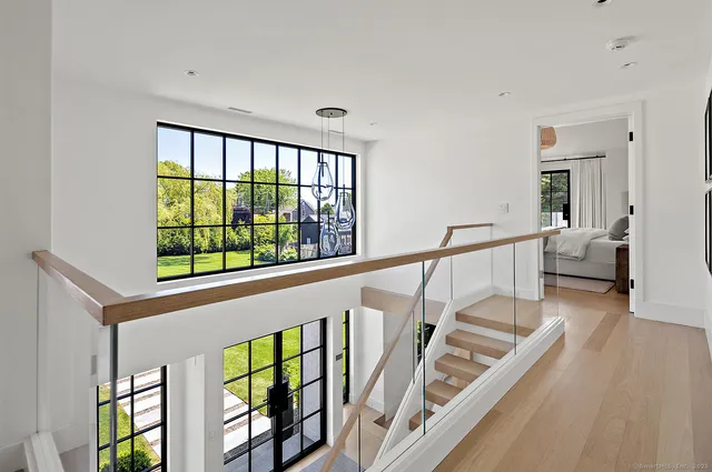 a view of an entryway with wooden floor