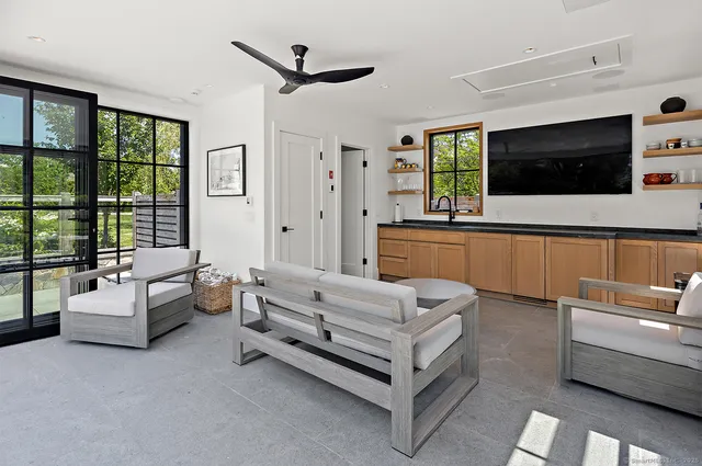 a spacious bedroom with a bed and a couch