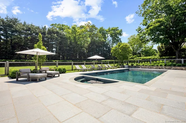 a view of pool with outdoor seating