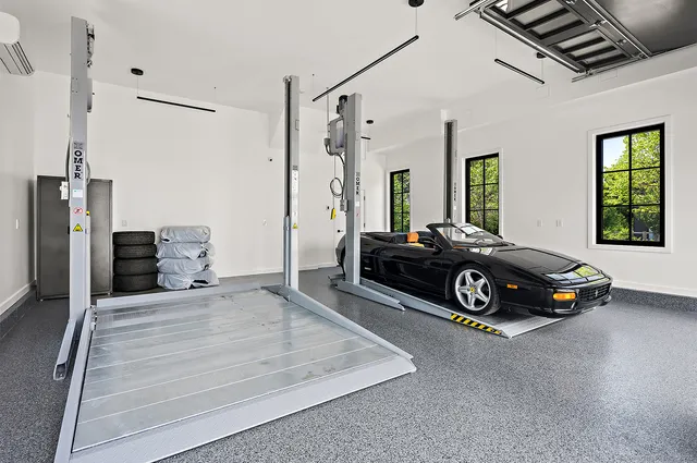 a bedroom with a bed a table and chairs with outer view