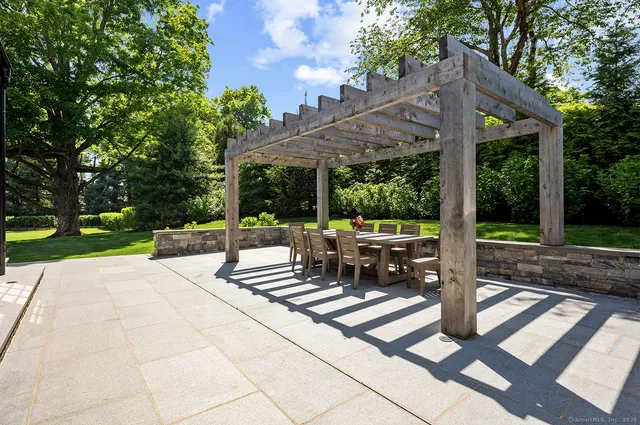 a view of a house with backyard porch and sitting area
