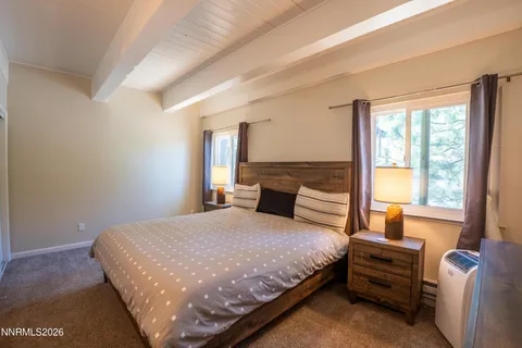 a view of a bedroom with washer and dryer