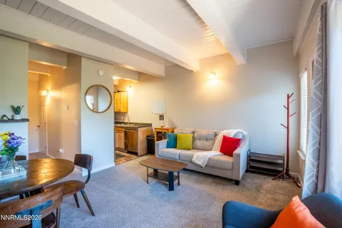 a living room with furniture and a table