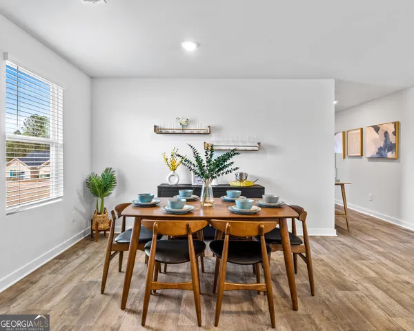 a kitchen with stainless steel appliances granite countertop a sink a stove a microwave a counter top space and cabinets