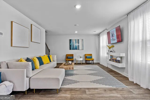 a bedroom with furniture and a window