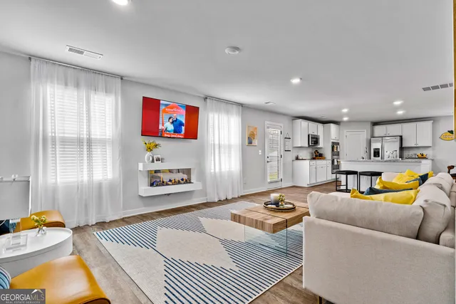 a living room with furniture and a window