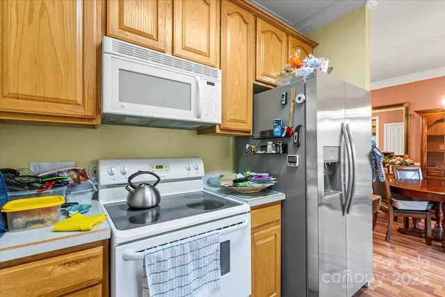 a kitchen with stainless steel appliances granite countertop a sink and cabinets