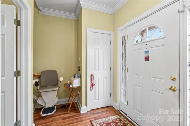 a view of a workspace with furniture and wooden floor