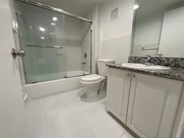 a bathroom with a sink and toilet