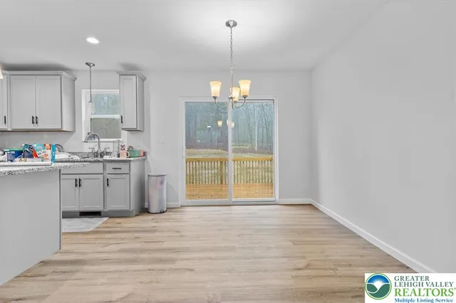 a view of a kitchen with a stove cabinets and a wooden floor