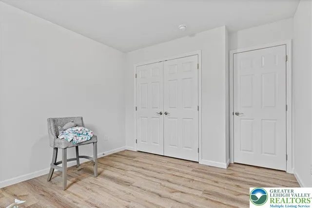 a view of an empty room and wooden floor