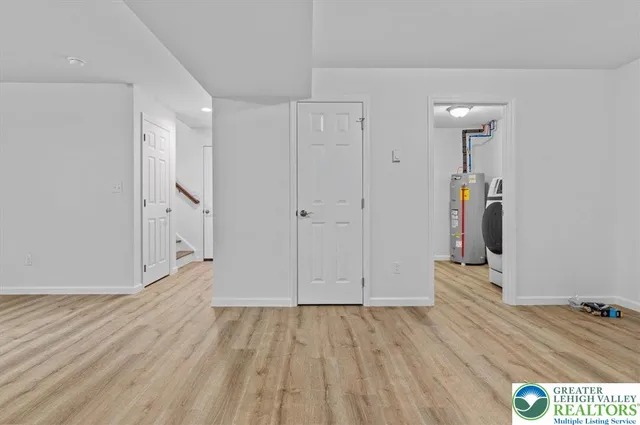 a view of hallway with wooden floor