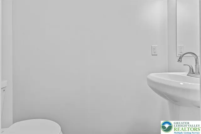 a bathroom with a toilet and sink