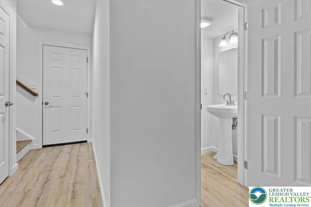 wooden floor with white cabinet