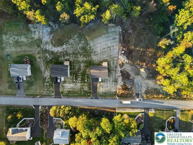 an aerial view of a house with a swimming pool