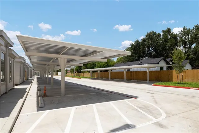 a view of a patio with a table and chairs