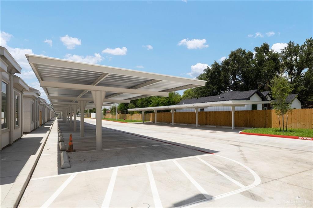 740 North Alamo Road, Unit 13 Alamo, TX 78516 - Photo 7 of 22 a view of a patio with a table and chairs