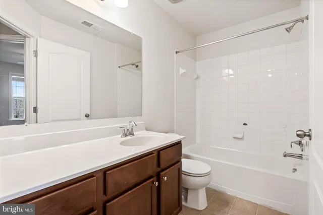 a bathroom with a sink a toilet and a bathtub