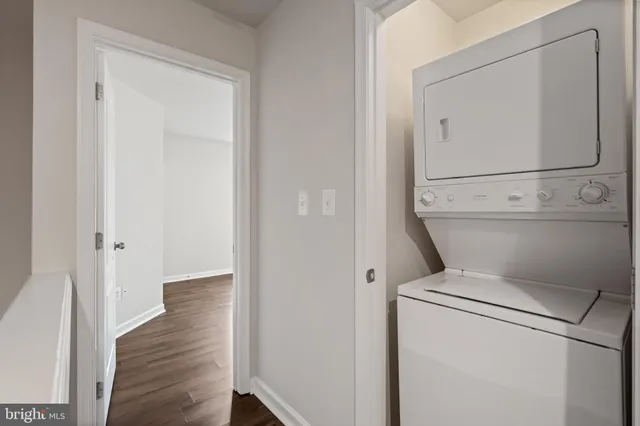 a view of washer and dryer with wooden floor