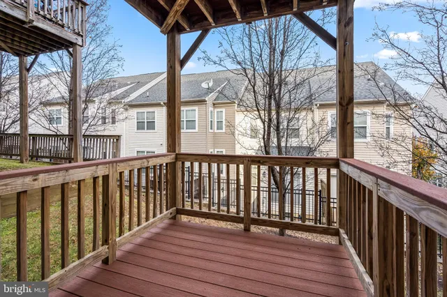 a view of a wooden deck with a yard