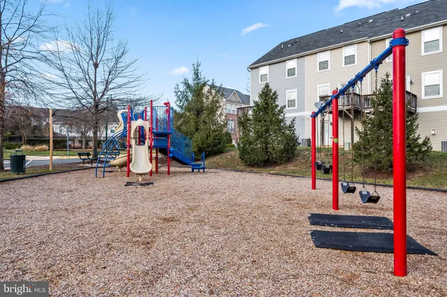 a view of a park with swings