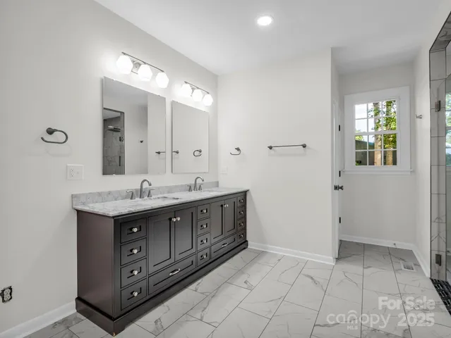 a bathroom with a sink and mirror
