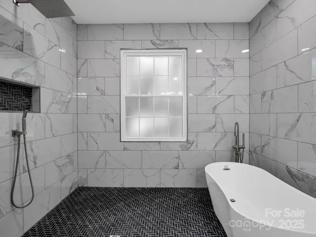 a view of a room with wooden floor stairs and a bathroom