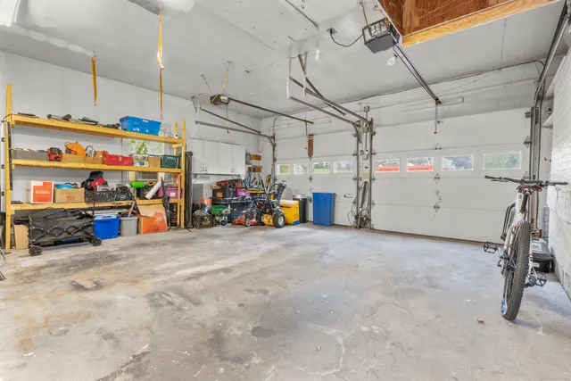 a view of water heater room with stairs